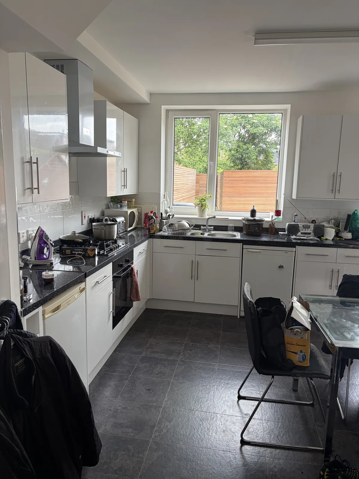 White kitchen before cleaning by HomeGlow Cleaning Services